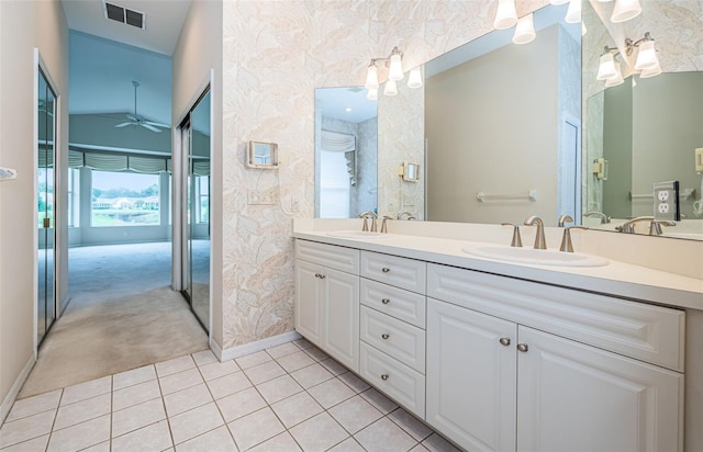 bathroom with tile patterned floors, visible vents, wallpapered walls, and a sink