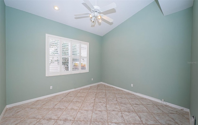 unfurnished room with ceiling fan, lofted ceiling, and baseboards