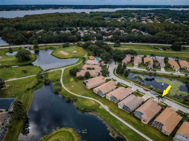 birds eye view of property featuring a residential view, view of golf course, and a water view