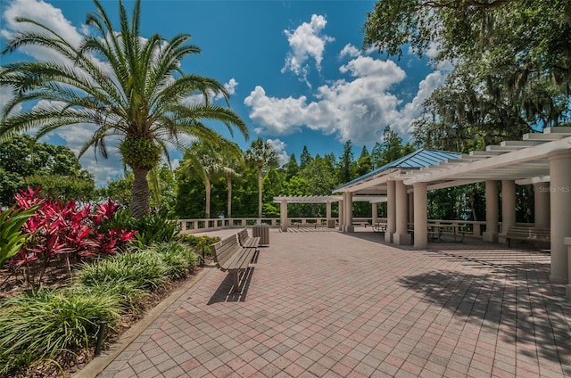 view of community featuring a patio and a pergola