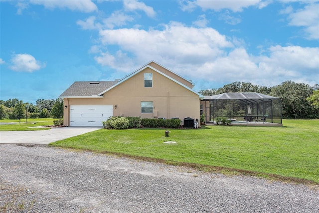 view of home's exterior featuring a lawn, driveway, and central AC unit