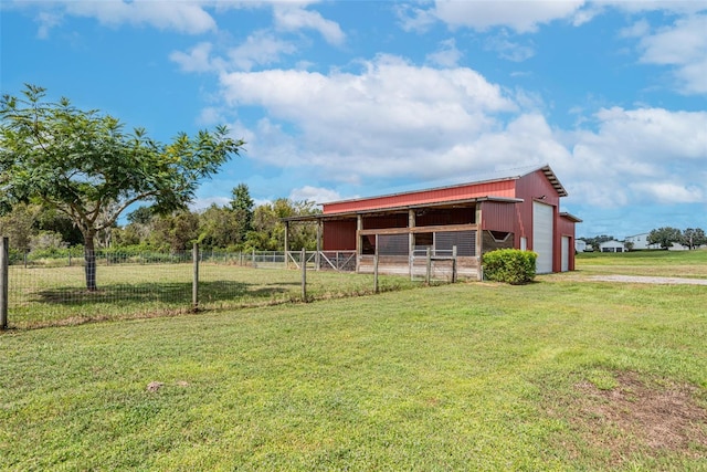 exterior space with an exterior structure, driveway, and an outbuilding