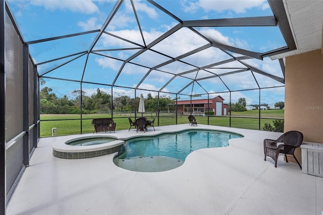 view of pool featuring glass enclosure, a pool with connected hot tub, a lawn, and a patio