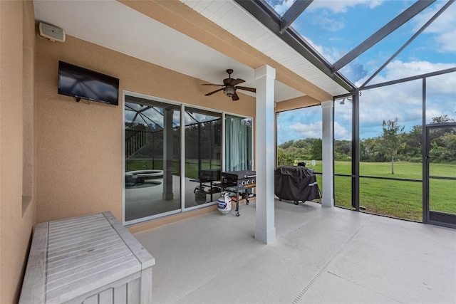 sunroom with a ceiling fan