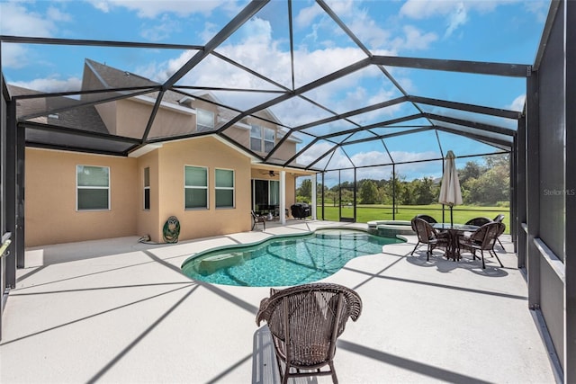 view of swimming pool featuring a lanai, a patio, and a pool with connected hot tub