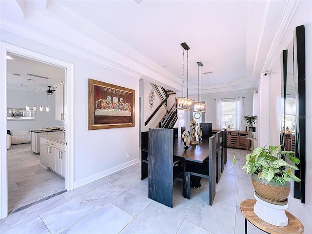 dining space featuring crown molding and ceiling fan