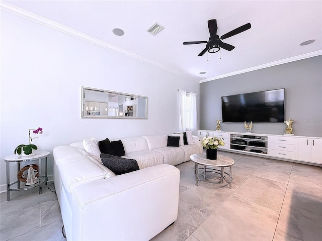 tiled living room with ceiling fan and crown molding