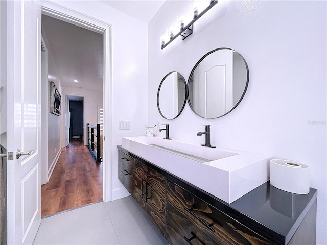 bathroom with wood-type flooring and vanity