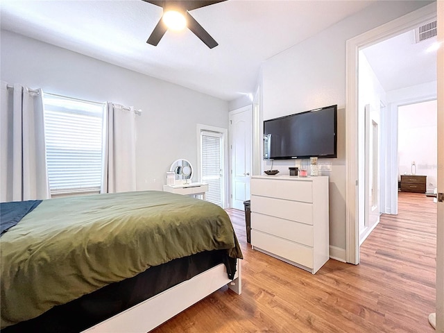 bedroom featuring light hardwood / wood-style flooring and ceiling fan