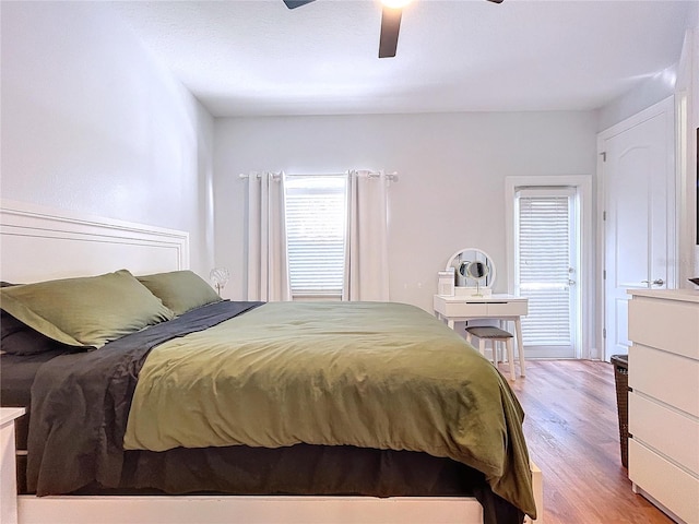 bedroom featuring light hardwood / wood-style floors and ceiling fan