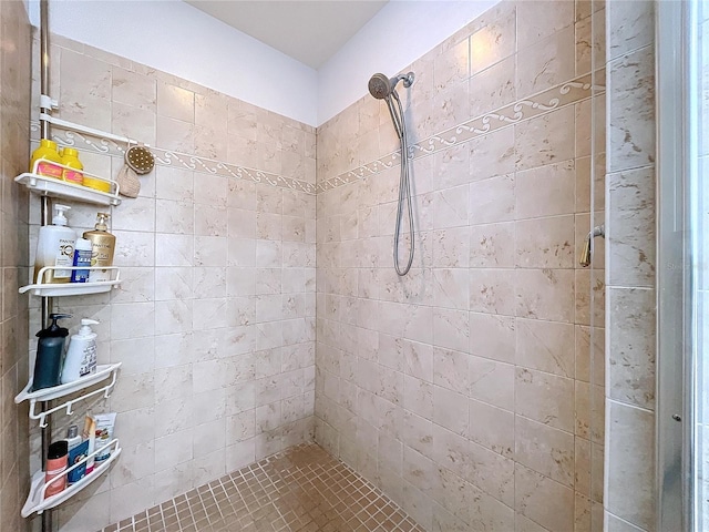 bathroom with tiled shower