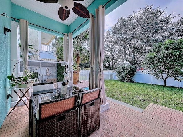 view of patio / terrace featuring ceiling fan