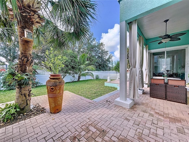 view of patio with ceiling fan