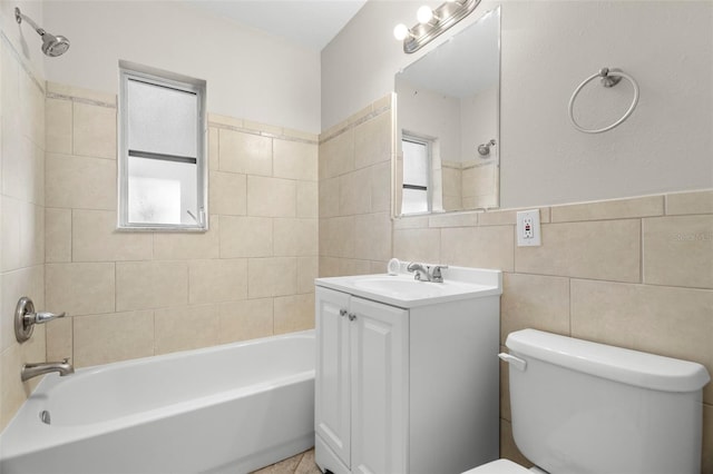 full bathroom with tiled shower / bath combo, a healthy amount of sunlight, and tile walls