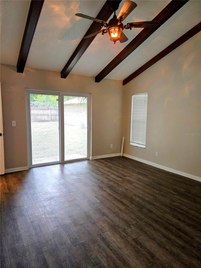 spare room with ceiling fan, vaulted ceiling with beams, and dark wood-type flooring