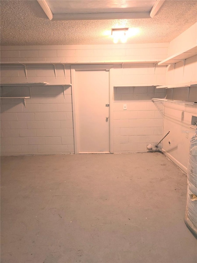 basement with a textured ceiling