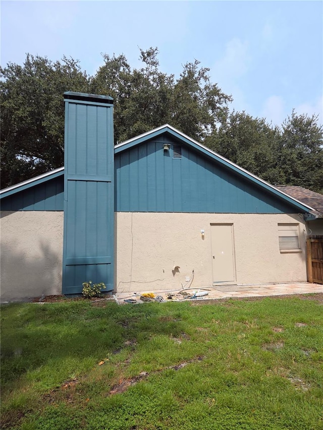 view of property exterior featuring a yard