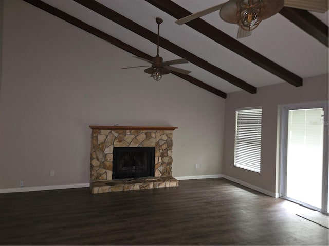 unfurnished living room featuring a fireplace, dark hardwood / wood-style flooring, beamed ceiling, and ceiling fan