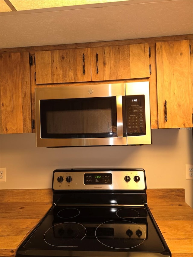 kitchen with black electric range oven