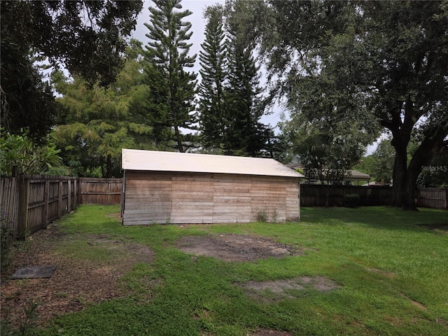 view of outdoor structure with a lawn