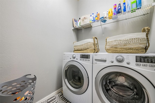 washroom featuring washer and clothes dryer