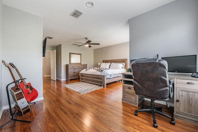 bedroom with ceiling fan and hardwood / wood-style floors