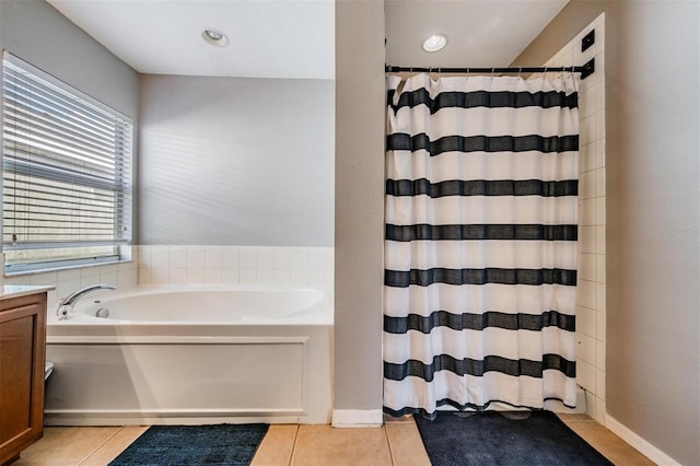 bathroom featuring independent shower and bath, tile patterned flooring, and vanity