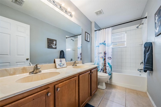 full bathroom featuring vanity, shower / bath combination with curtain, a textured ceiling, tile patterned flooring, and toilet