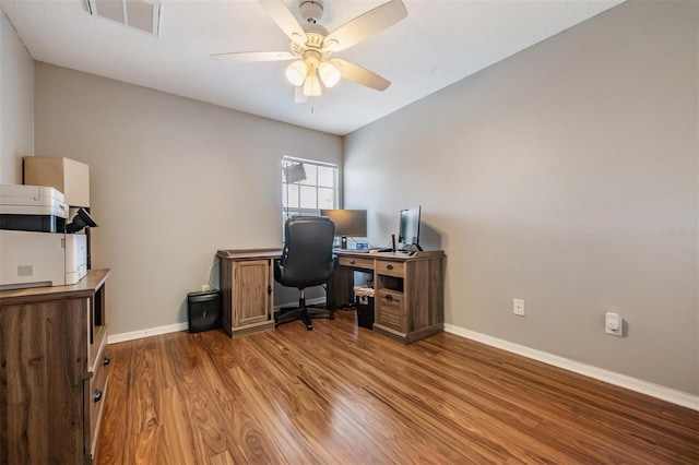 home office with ceiling fan and hardwood / wood-style flooring