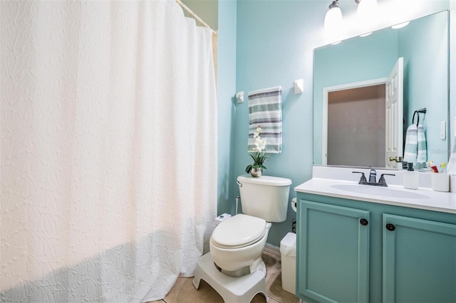 bathroom with tile patterned floors, vanity, and toilet