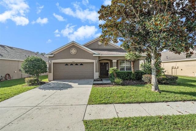 ranch-style house with a garage and a front yard