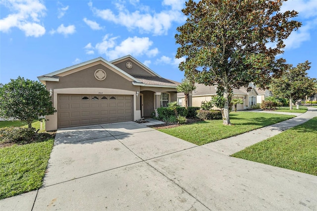 view of front facade featuring a front yard and a garage