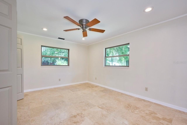 empty room with ceiling fan and ornamental molding