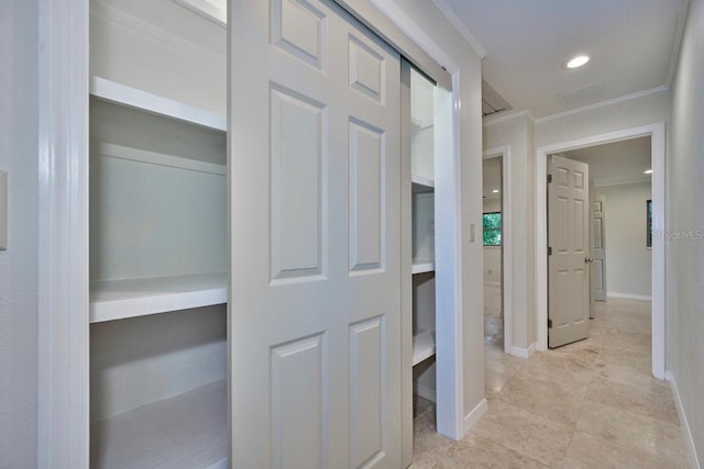 hall with recessed lighting, baseboards, and ornamental molding