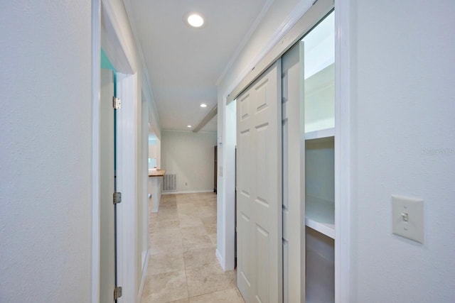 corridor featuring visible vents, recessed lighting, crown molding, light tile patterned floors, and baseboards