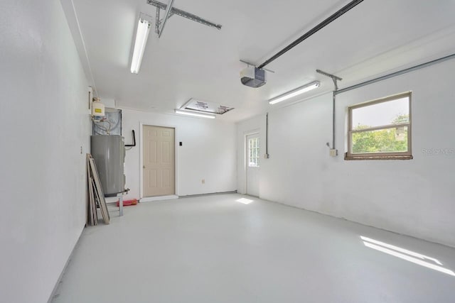 garage with a garage door opener and water heater