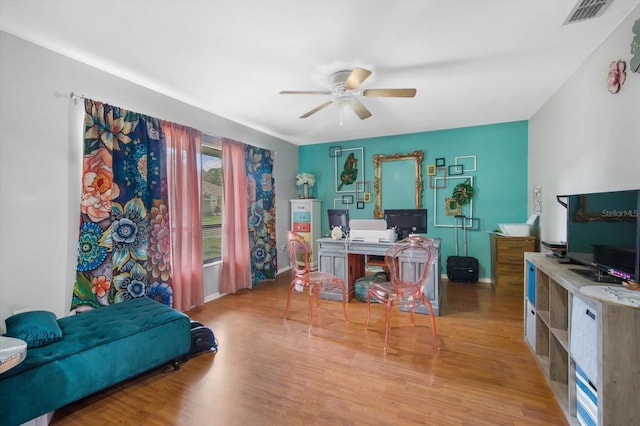 office area featuring light hardwood / wood-style flooring and ceiling fan