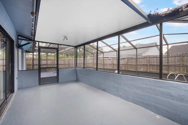 unfurnished sunroom featuring plenty of natural light