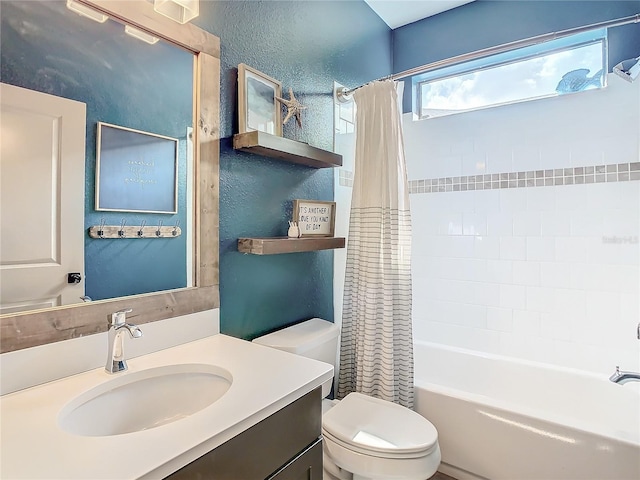 full bathroom with shower / bath combination with curtain, toilet, and vanity