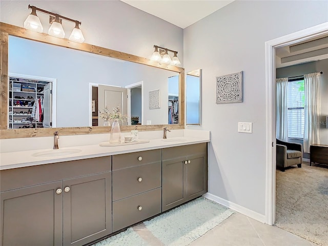 bathroom featuring tile patterned flooring and vanity