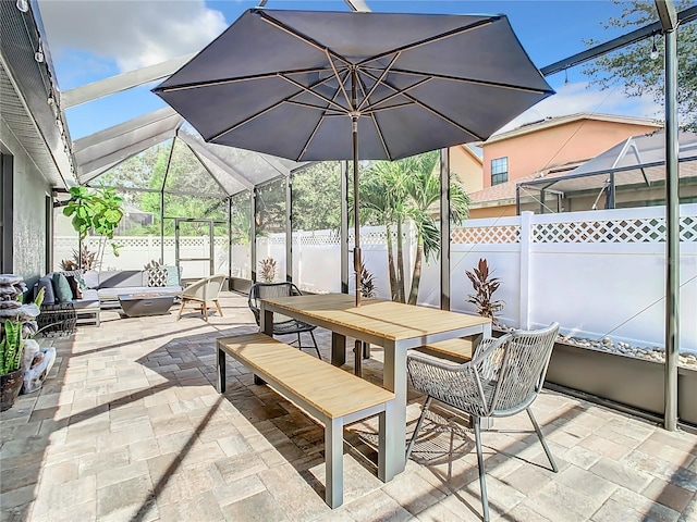 view of patio / terrace with glass enclosure