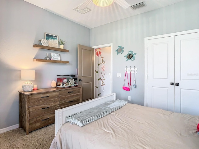 carpeted bedroom with a closet and ceiling fan