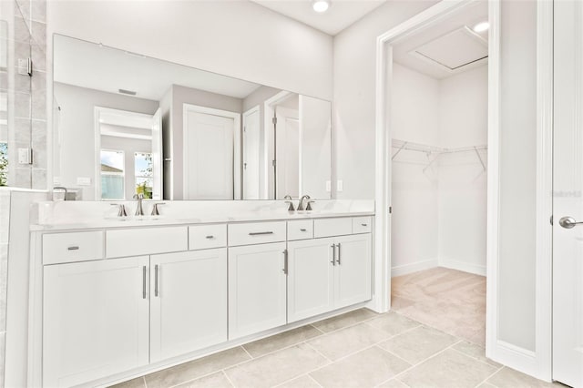 bathroom featuring tile patterned flooring and vanity