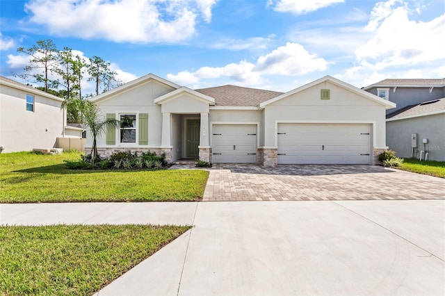 23176 Pachino Way, Lutz, FL 33549 - ranch-style house with driveway, stone siding, an attached garage, a front yard, and stucco siding