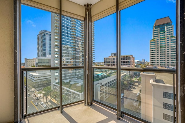 unfurnished sunroom with a view of city
