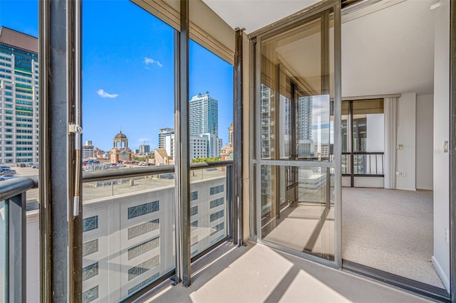 unfurnished sunroom with a view of city