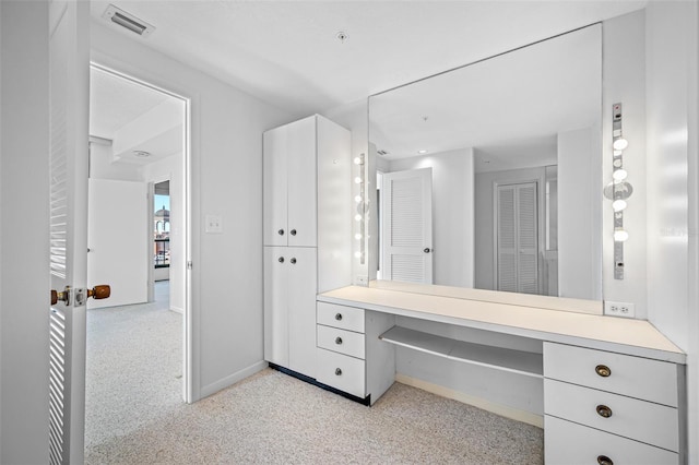 bathroom with baseboards and visible vents