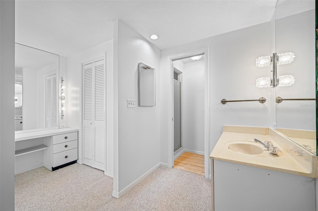 full bath featuring carpet flooring, a closet, baseboards, and vanity