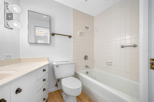 full bathroom featuring baseboards, toilet, vanity, and shower / bathtub combination