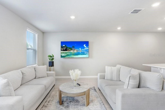 living room with light hardwood / wood-style floors